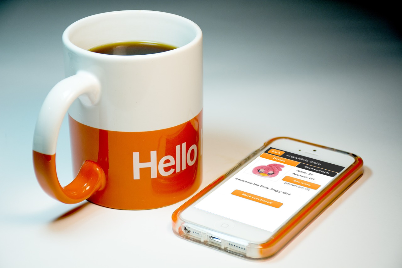 Cup with hello text and Mobile phone with WishSimply app